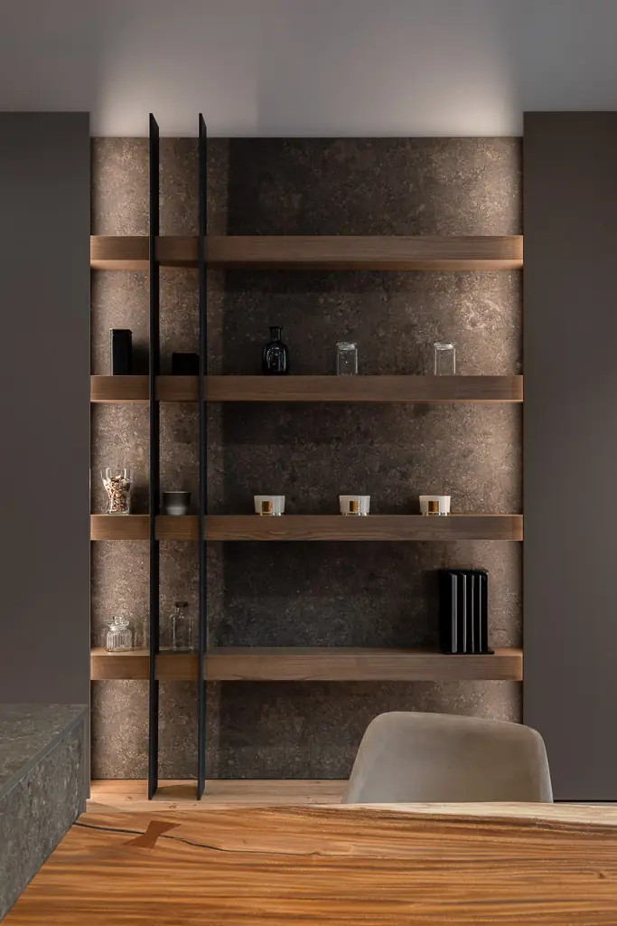 dormitorio moderno con mesilla lampara de diseno y ramas decorativas