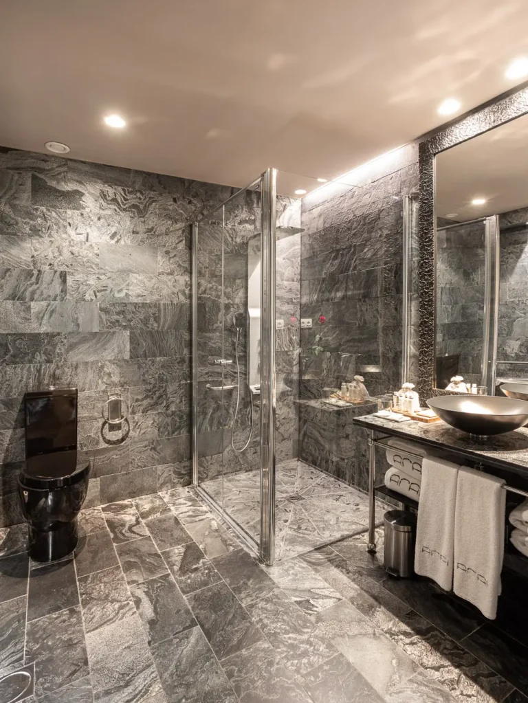 bano hotel piedra gris ducha cristal lavabo